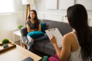 teen talking with a therapist in a depression treatment program
