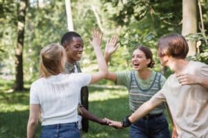 group of teenage boys and girls participating in one of 6 activities to combat anxiety by playing outside.