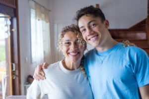 image of smiling teenage couple whose parents learned the importance of supporting your teen in a new relationship