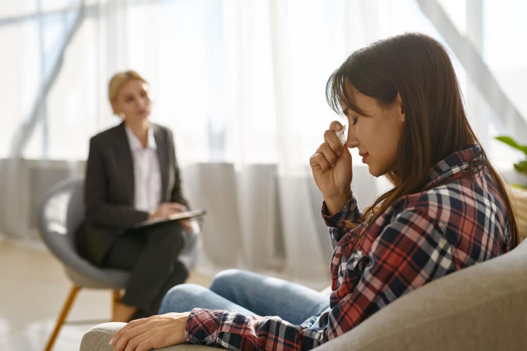 behavioral health therapist talking to a mother about finding anxiety treatment in Omaha, NE, for her teenager.